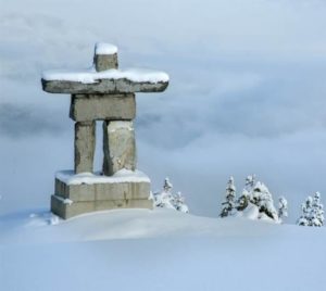 an inuksuk on a bleak wintery landscape